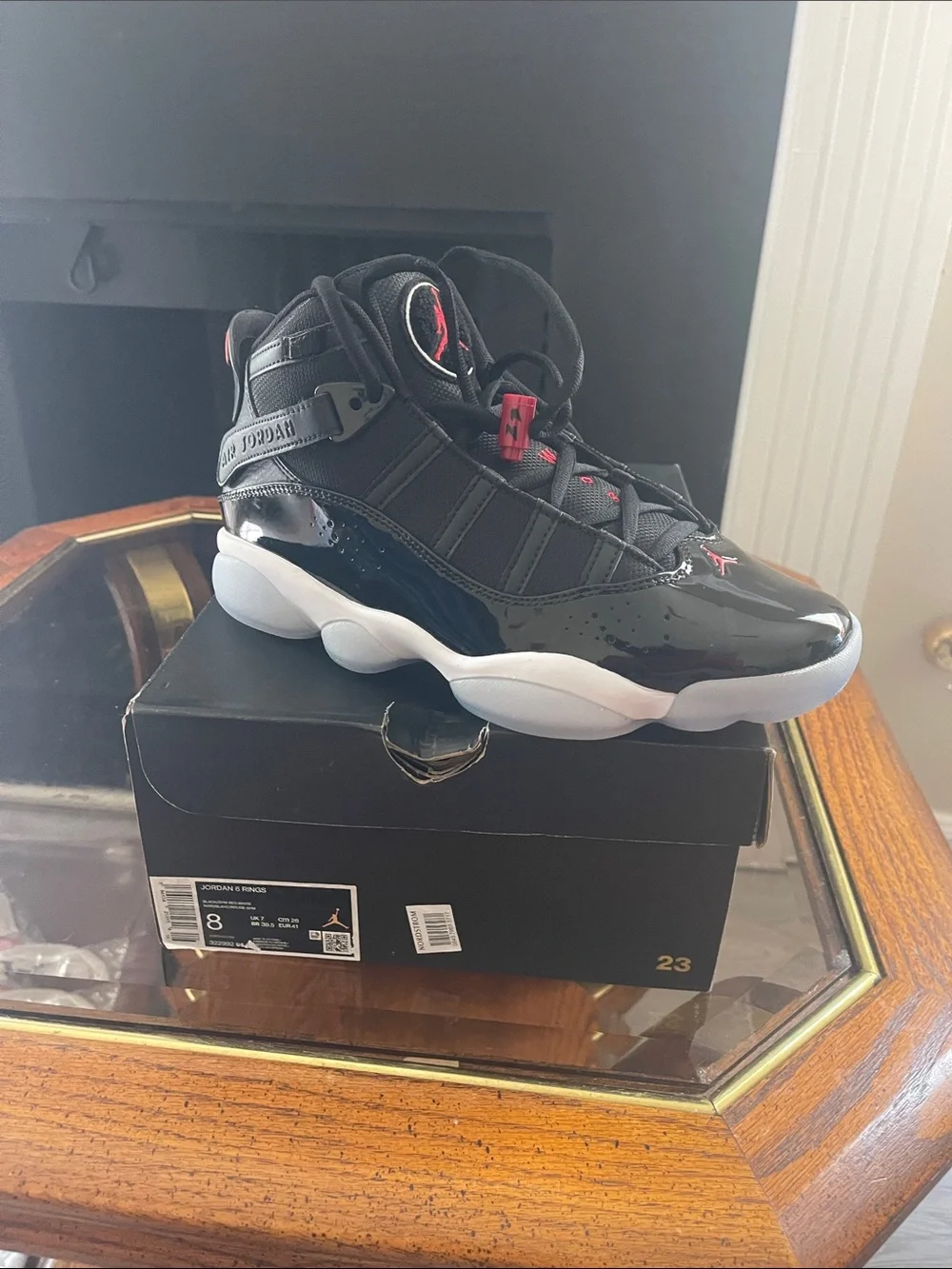 Jordan men’sHigh-Top Sneakers in Black with Red Accents